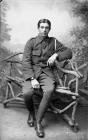 Soldier sitting on rustic bench