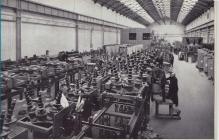 Workers - men and women - in Switchgear factory...