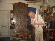 Hugh Haley repairing the Black Chair