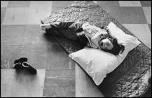 A Young Ely Hospital patient resting on the floor