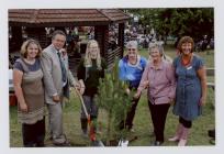 Planting a tree at the Royal Welsh Showground...