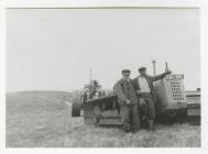 Two Forestry Workers in Front of Caterpillar