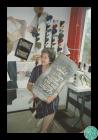 Photograph of Trude Owen in her studio, holding...