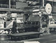 Factory worker at production line, Rheola Works...