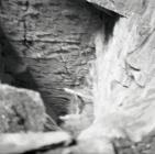 Looking down into deep chamber, Aberllefenni...