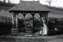 Well with woman collecting water, Usk area c.1900