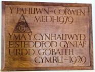 Wooden plaque inscribed " Yma y cynhaliwyd...