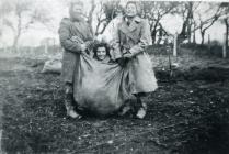 Land Army women in a sack race