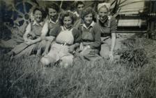 A group of Land Army women relaxing