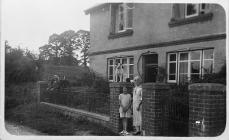 A family in front of their home 