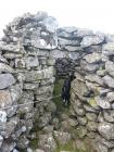 Cairn in Rhayader area with dog being walked