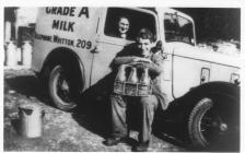 Annie Pugh and Bob Johnson delivering milk in...