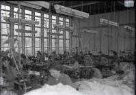 Glass negative: Factory interior with sewing...