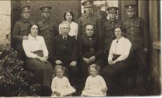 Mr and Mrs Byrne and family with Soldiers, 1914