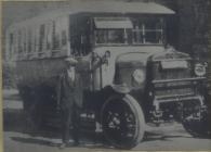 Robert Owen (R.O.) Phillips with his bus at...