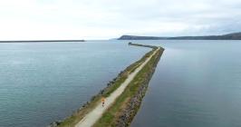 Aerial view of the breakwater at Goodwick Sands...