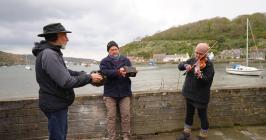 A sea shanty group, including Gary Jones ...