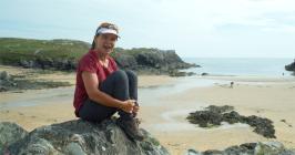 Eila Wilkinson sitting on the beach at Porth...