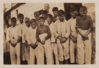 Group of boys dressed for an unknown event,...