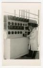 Man in front of control board, Felin Fach Creamery