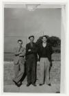 Three men standing in front of wall, Felin Fach...